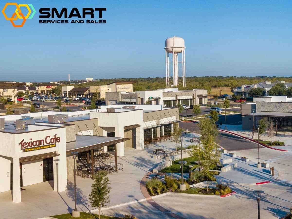 Aerial view of Downtown Kyle Texas showing shops restaurants and a water tower in the background